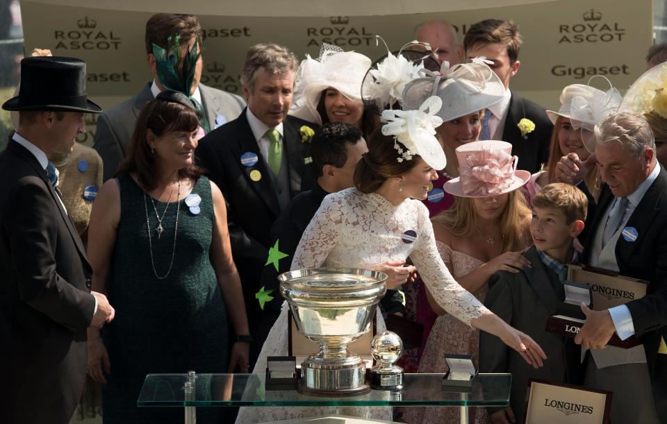  The Duchess of Cambridge prepares to present Puerto Rican-born American jockey John Velazquez with the trophy, after he rode Lady Aurelia to win the King's Stand Stakes horse race