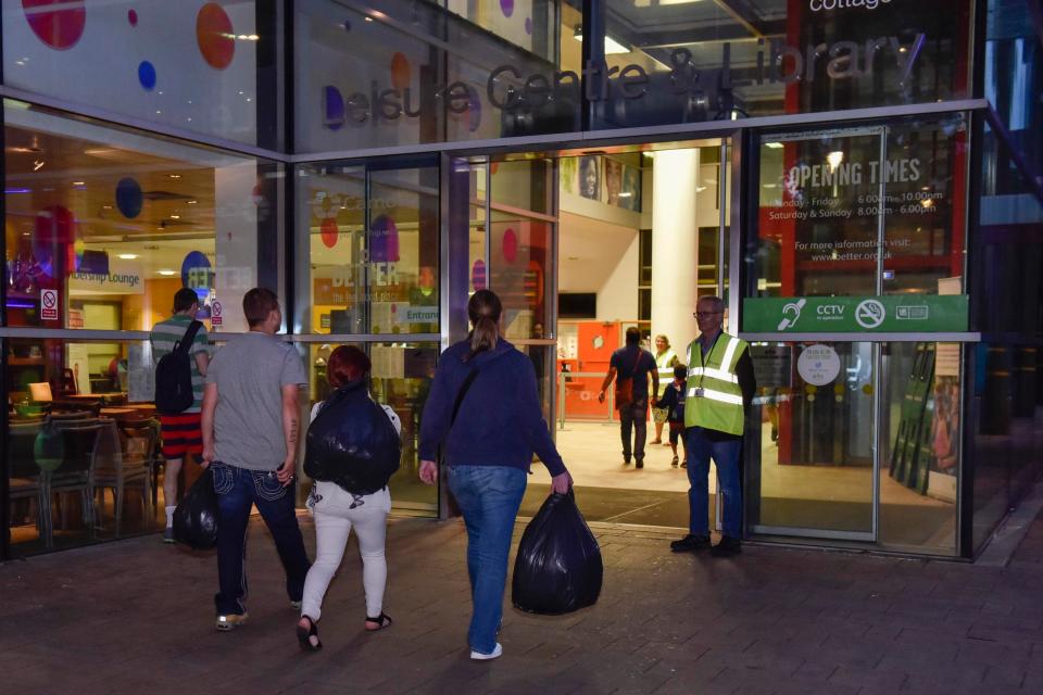  Residents arrive at a rest centre in Swiss Cottage