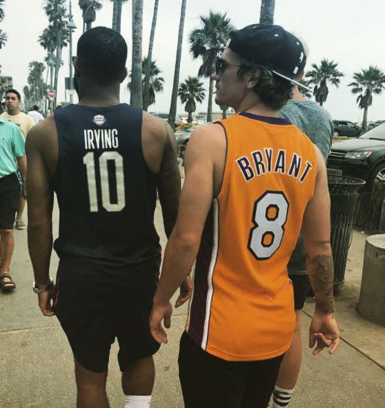  The duo were spotted in basketball shirts near the beach