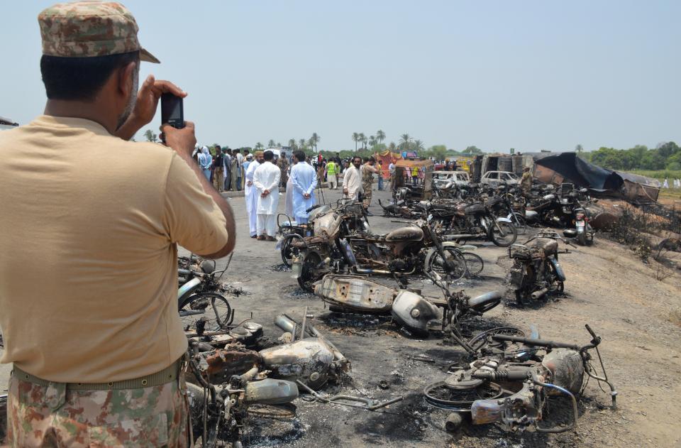 Charred wreckage of dozens of motorcycles and cars were scattered on the highway