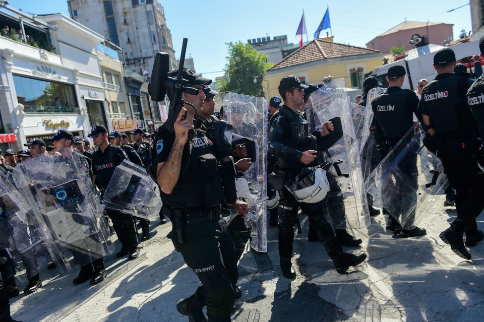 Riot cops wielded pepper spray ball guns and riot shields