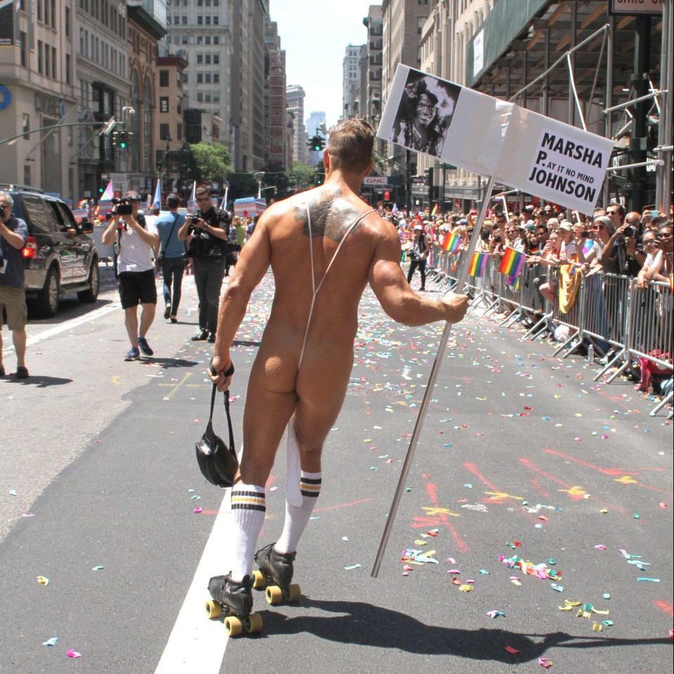 A sock secured by a thong and some roller skates are the only clothing this marcher needed