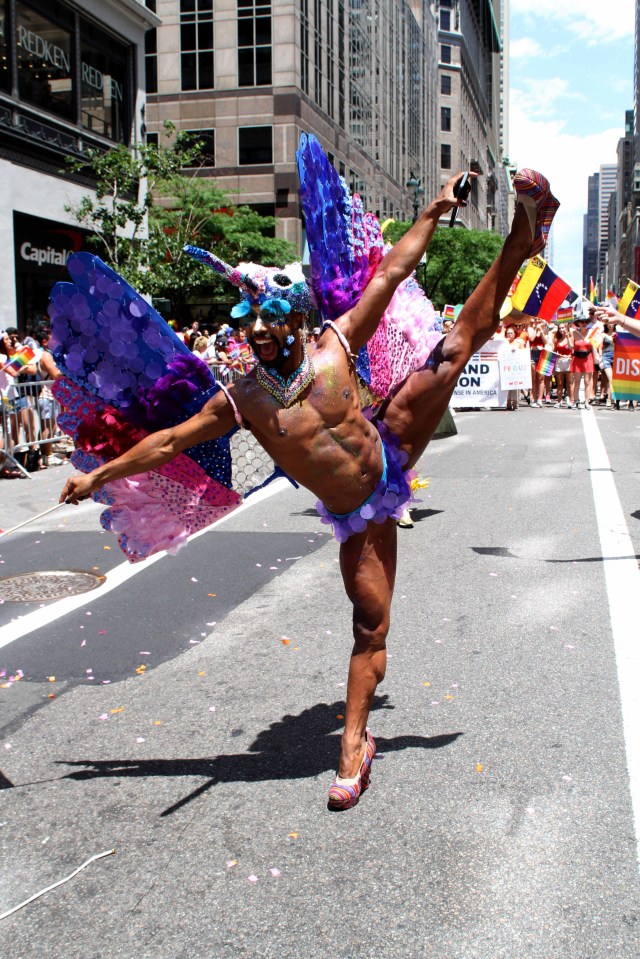 A dancers shows off his impressive skills to the cheering crowd