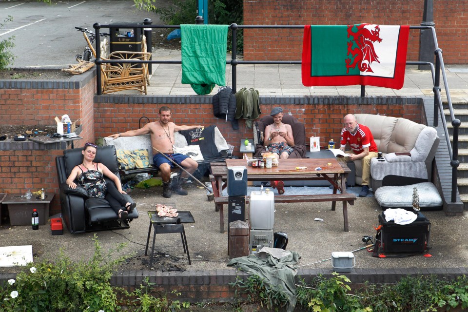 A group of homeless people have set up home with discarded furniture on the banks of a canal in Salford