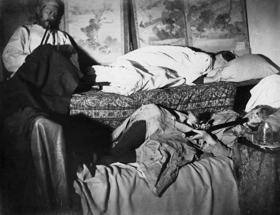  Two women and a man smoking in an opium den in Chinatown, San Francisco, circa 1890