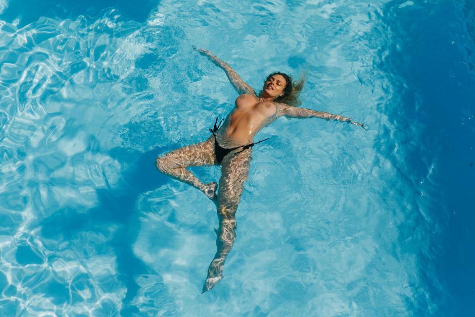  The raunchy star is clearly not shy as she lays exposed in the water