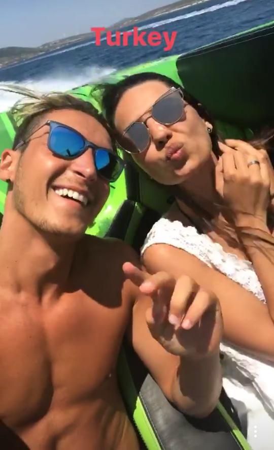  Mesut Ozil and fiancee Amine Gulse relax while on a speedboat in Turkey