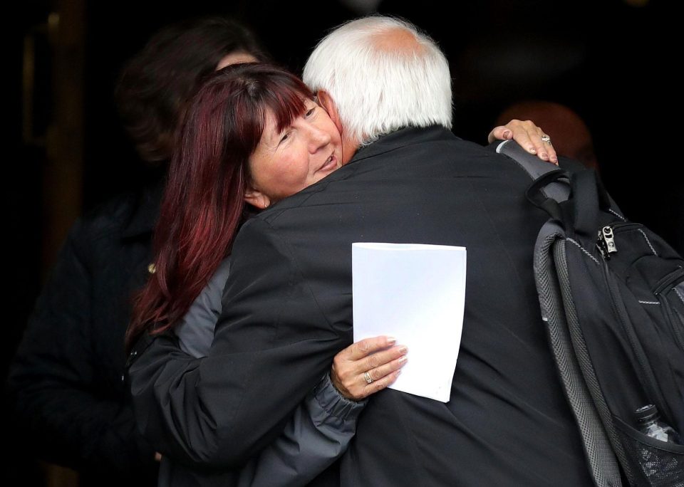  Trevor Hicks hugs a family member after the families of the 96 Hillsborough victims were told the decision that the Crown Prosecution Service will proceed with criminal charges