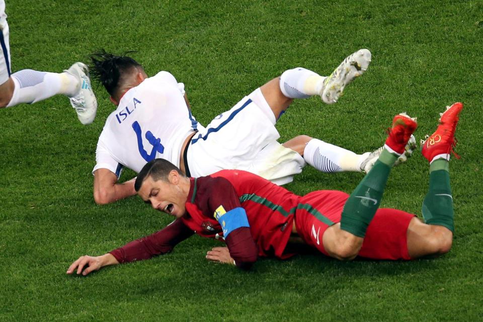  Mauricio Isla challenges Cristiano Ronaldo in the Confederations Cup semi-final