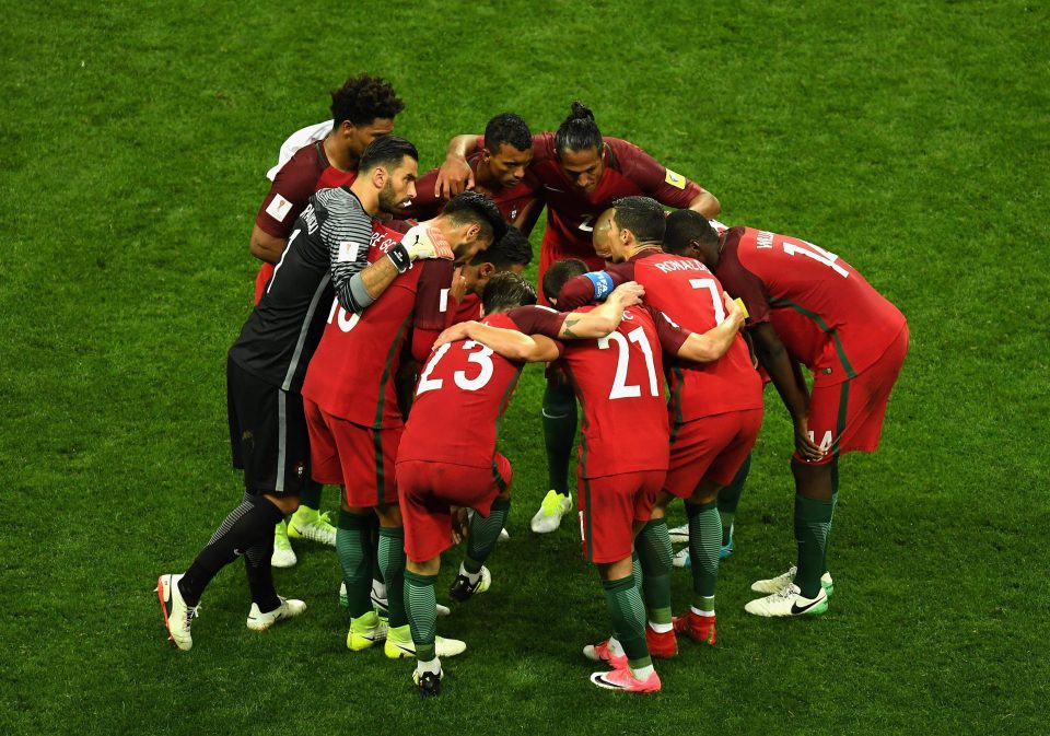  The Euro 2016 champions huddle together ahead of the first half of extra-time