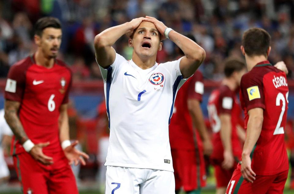  Alexis Sanchez reacts after his header flashed inches wide of nestling into the bottom left corner