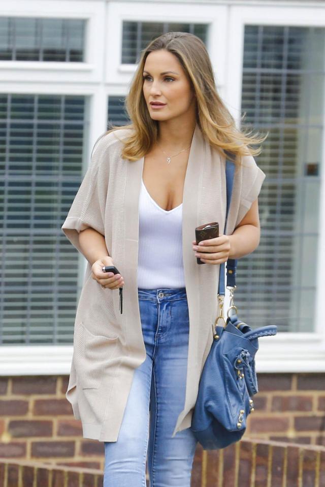  Sam Faiers walks out of her home wearing a white vest top, cardigan and jeans