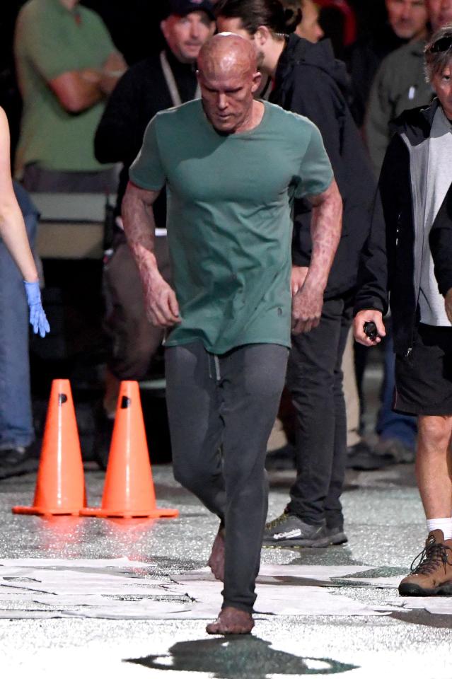  The actor walks barefoot across the set