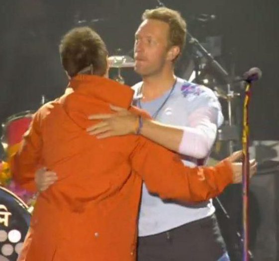  He paired up with Coldplay, led by Chris Martin, to sing two classic hits in tribute to terror victims