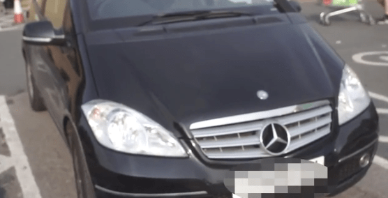  A Mercedes hatchback said to be parked in a disabled spot