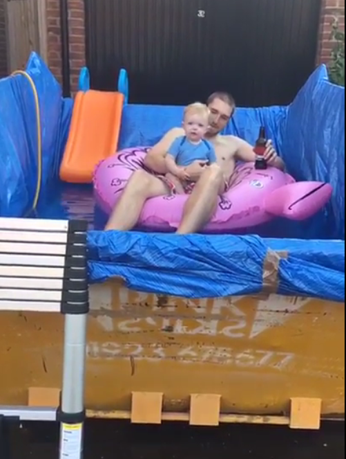  The dad used a skip filled with water to cool down in the heatwave