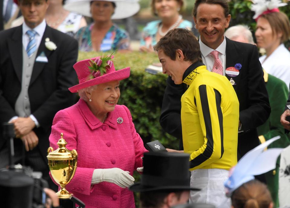  Winning jockey James Doyle shares a joke with Her Majesty!