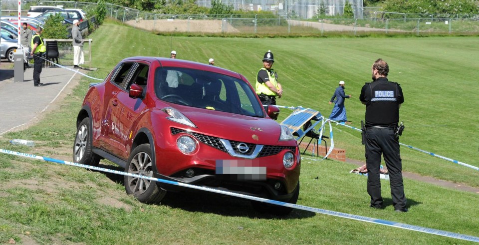 The car involved in the crash is guarded by police at the scene today