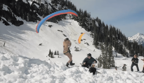 One of the parachutist’s skis appeared to clip the girl’s baseball cap as it came in to land