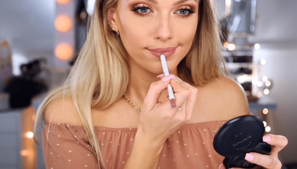  Alli then used a brown pencil and gloss on her lips