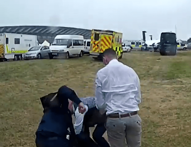  Robinson appears to punch the other man as he lies on the ground