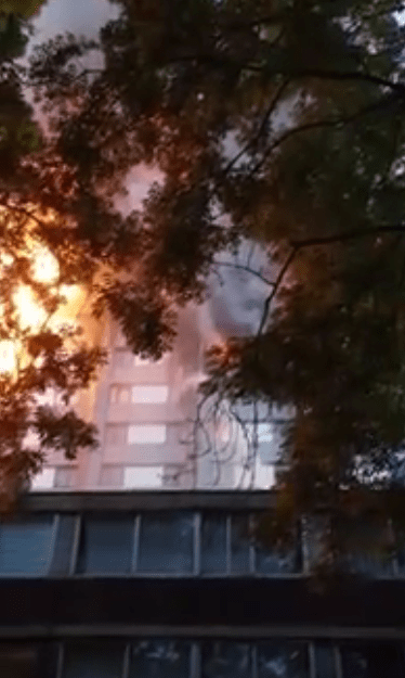  Smoke billows from a blazing flat at Grenfell Tower where a woman was trapped