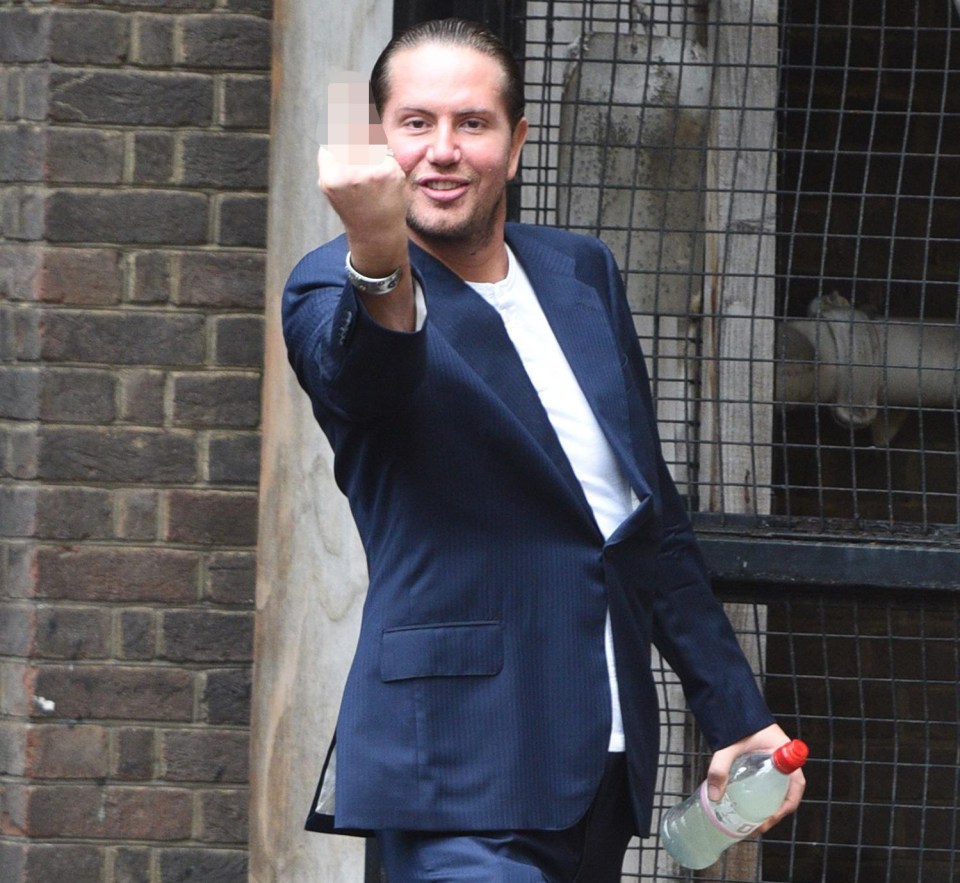 James Stunt flashes his middle finger at photographers as he leaves the High Court