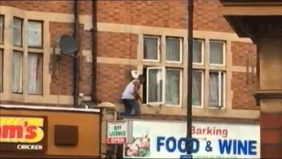  One man could be seen scrambling over the roof as armed cops swooped