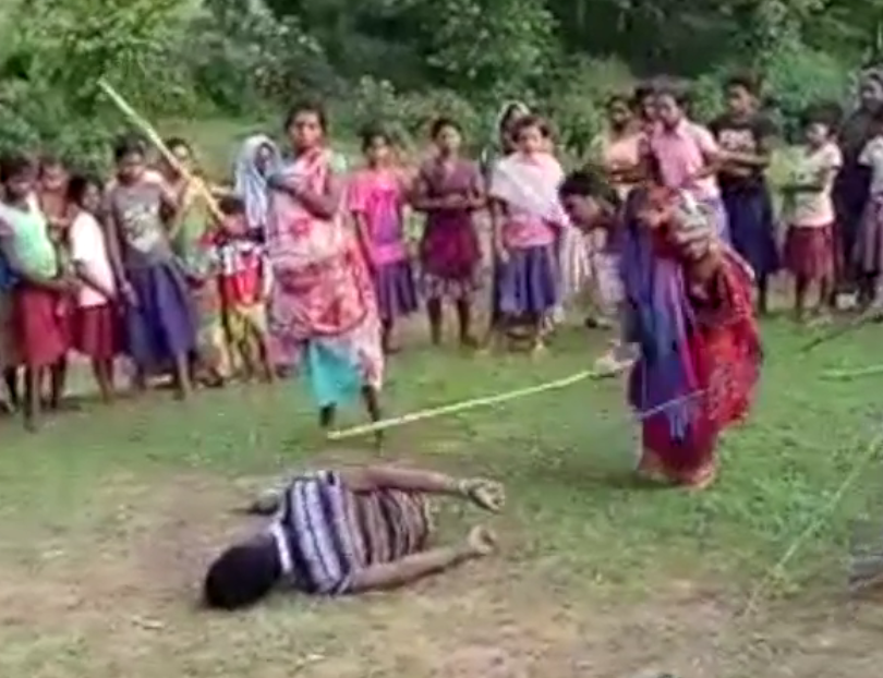  The mum was seen thrashing the man accused of raping and killing her daughter, seven, during the lynching