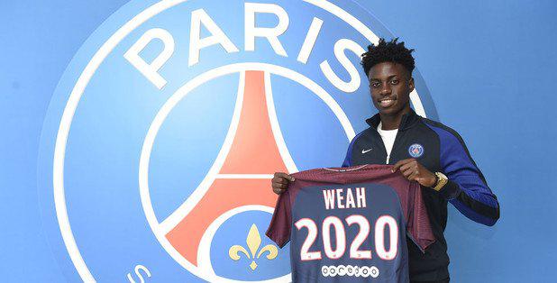  Timothy Weah poses with Paris Saint-Germain shirt after signing pro contract