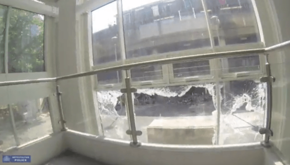  A shattered window on one of the floors of Grenfell Tower following the carnage