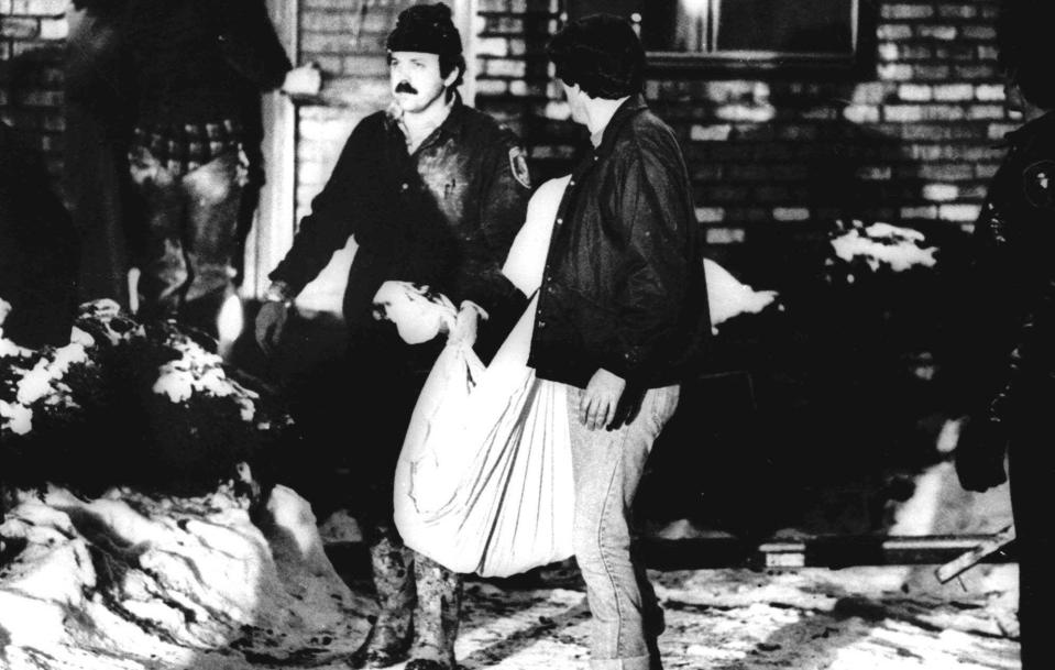  Cook County sheriff's police remove some of the bodies from Gacy's home in December 1978