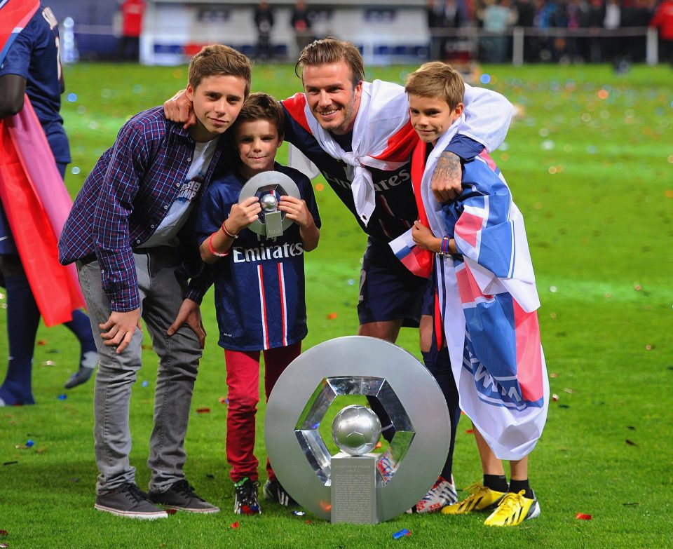  Beckham, pictured with his three boys, did win the title with PSG