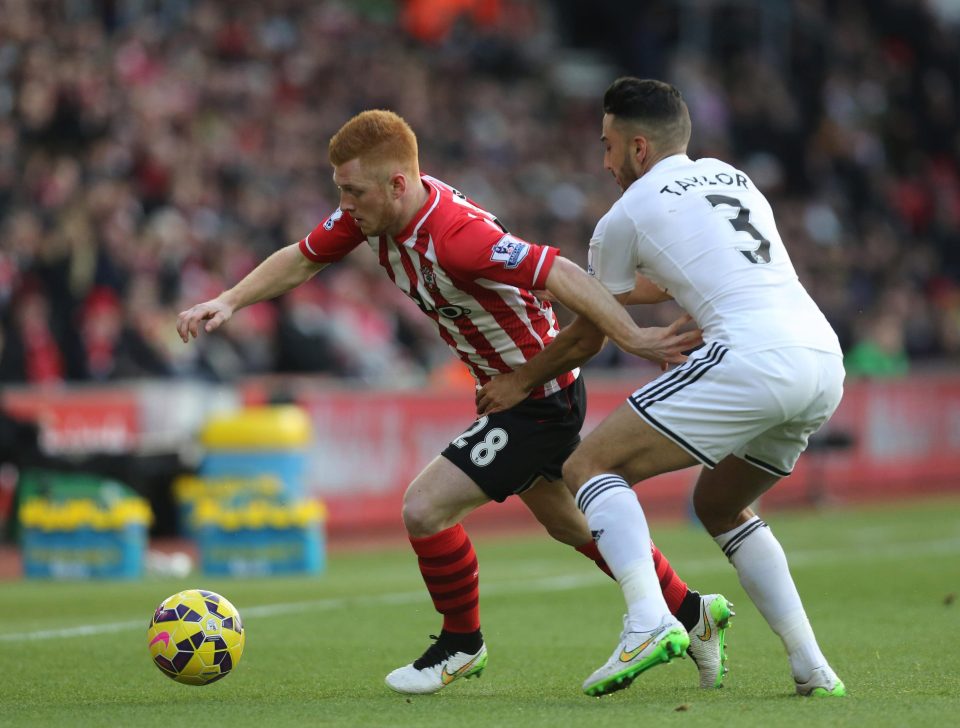  Reed in action against former Swansea left-back Neil Taylor