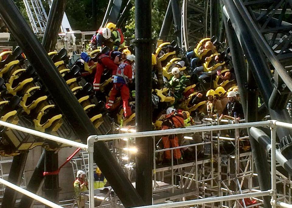  West Midlands Ambulance service paramedics work to free people from the Smiler ride after an accident in 2015