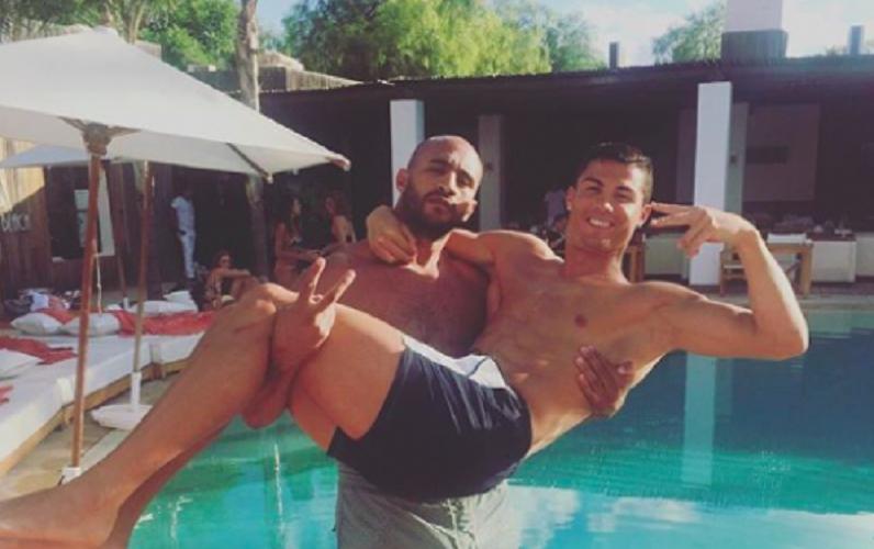  Cristiano Ronaldo lies in the arms of kickboxer pal Badr Hari