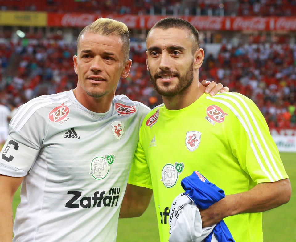  Argentinian Andreas D'Alessandro poses with Alan Ruschel ahead of the 'Lance de Craque' charity game