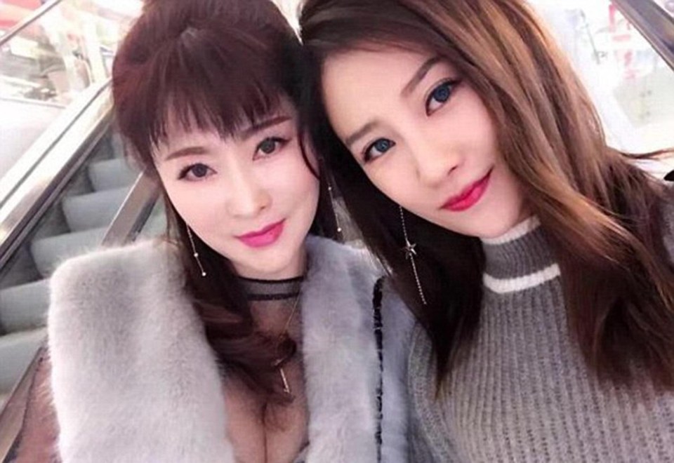 Xu Min, left, poses with her 25-year-old daughter in Kunming