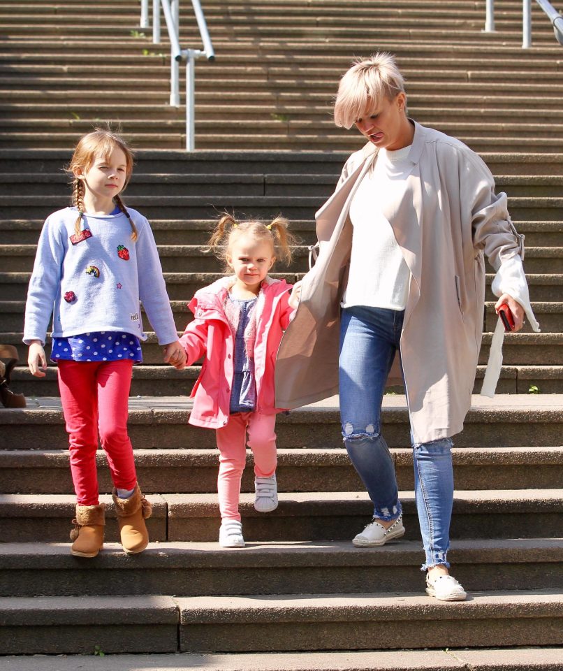  Dylan-George, centre - with sister Heidi and Kerry - had long hair before her spontaneous trim