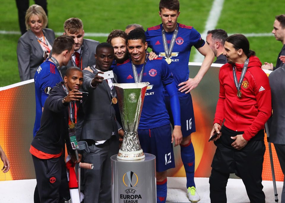  Ashley Young with Eric Bailly, Daley Blind and Chris Smalling taking selfies with the trophy after the UEFA Europa League Final