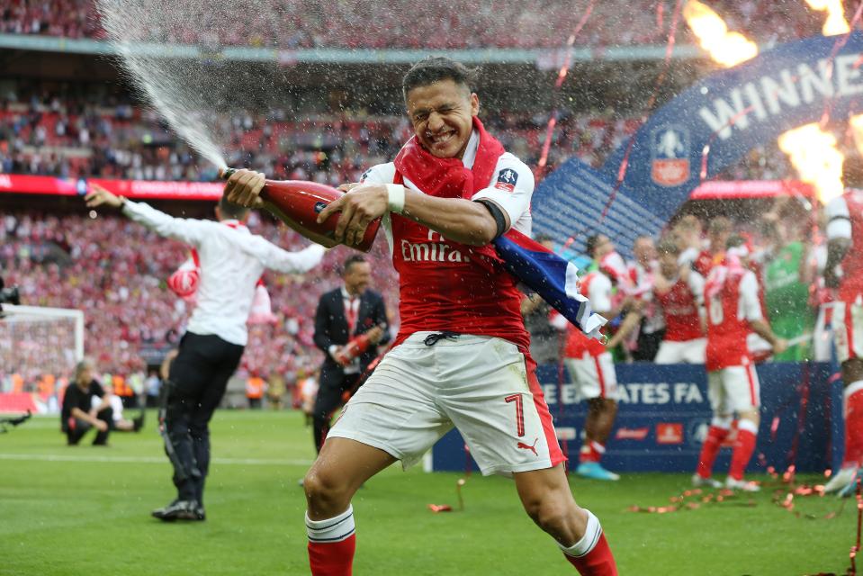  The 28-year-old celebrates Arsenal's FA Cup triumph after they beat London rivals Chelsea 2-1