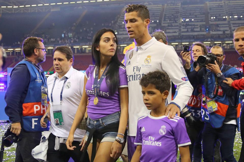  Cristiano Ronaldo, Georgina Rodriguez and Cristiano Ronaldo Jr walk off the pitch in Cardiff after Real Madrid win the Champions League