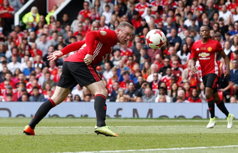  Wayne Rooney heads the ball for Manchester United during Michael Carrick's testimonial