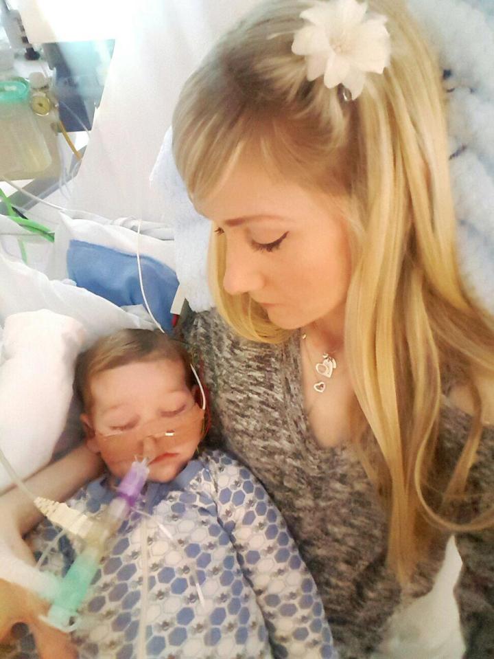  Connie cradles baby Charlie who she desperately fought to save