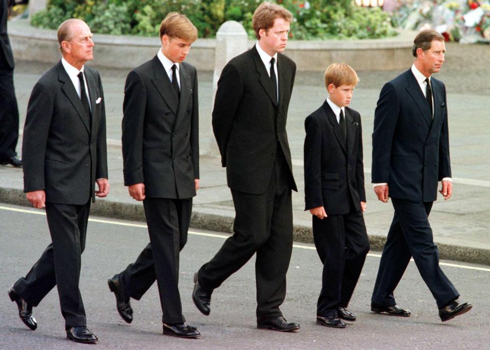  The young Prince William and Prince Harry walk with Princes Charles and Philip and Princess Diana's brother at her funeral