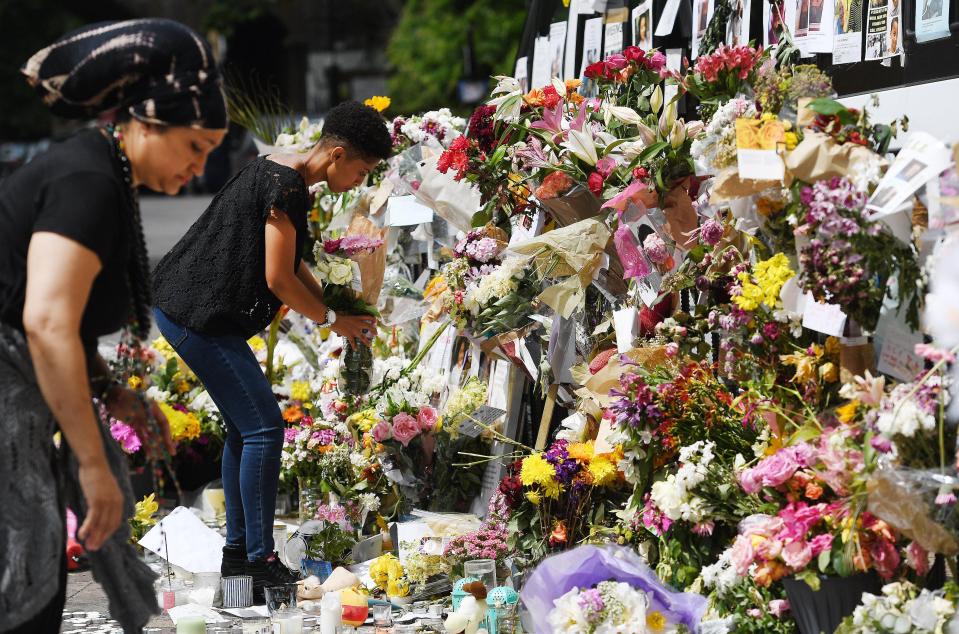  Tributes left close to the tower in South West London