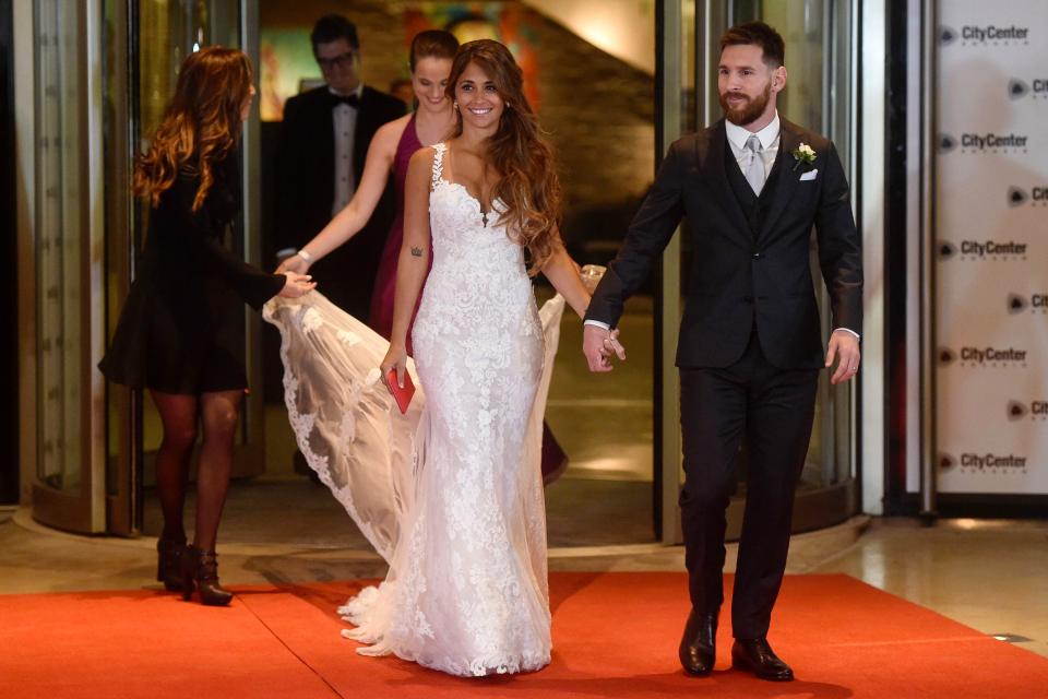  Lionel Messi looked proud as he walked hand-in-hand with his new bride