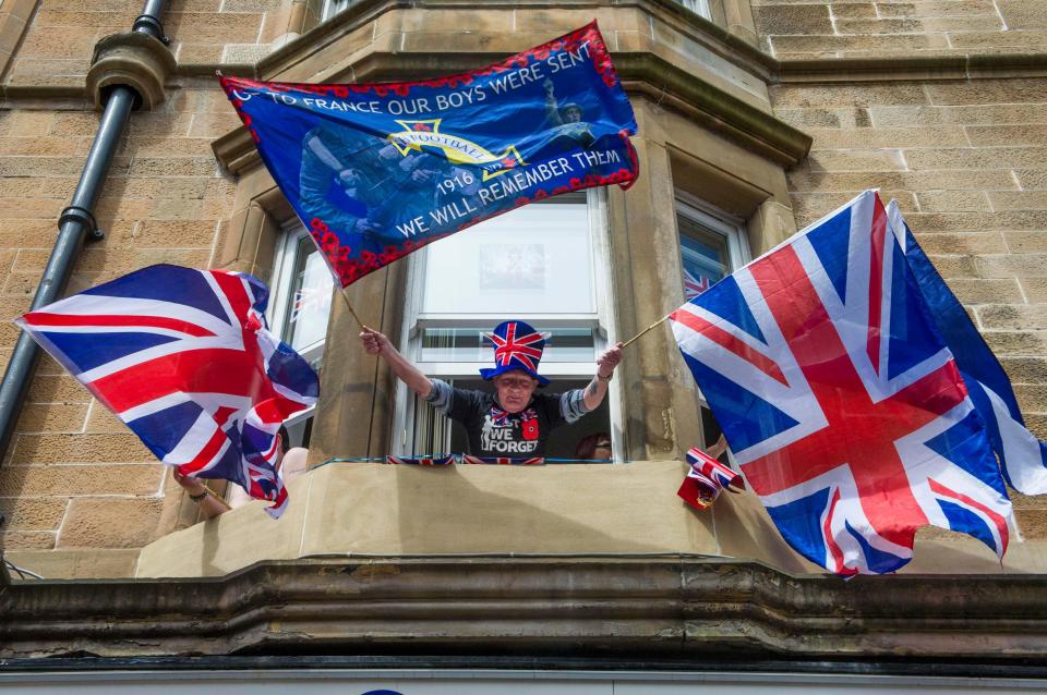  A proud Orangeman displays Union flags during the event in Glasgow