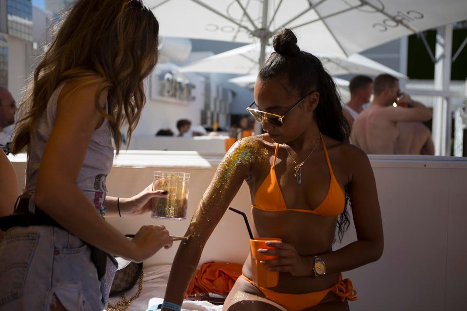  The Little Mix star showed off her famously flawless figure in an orange bikini