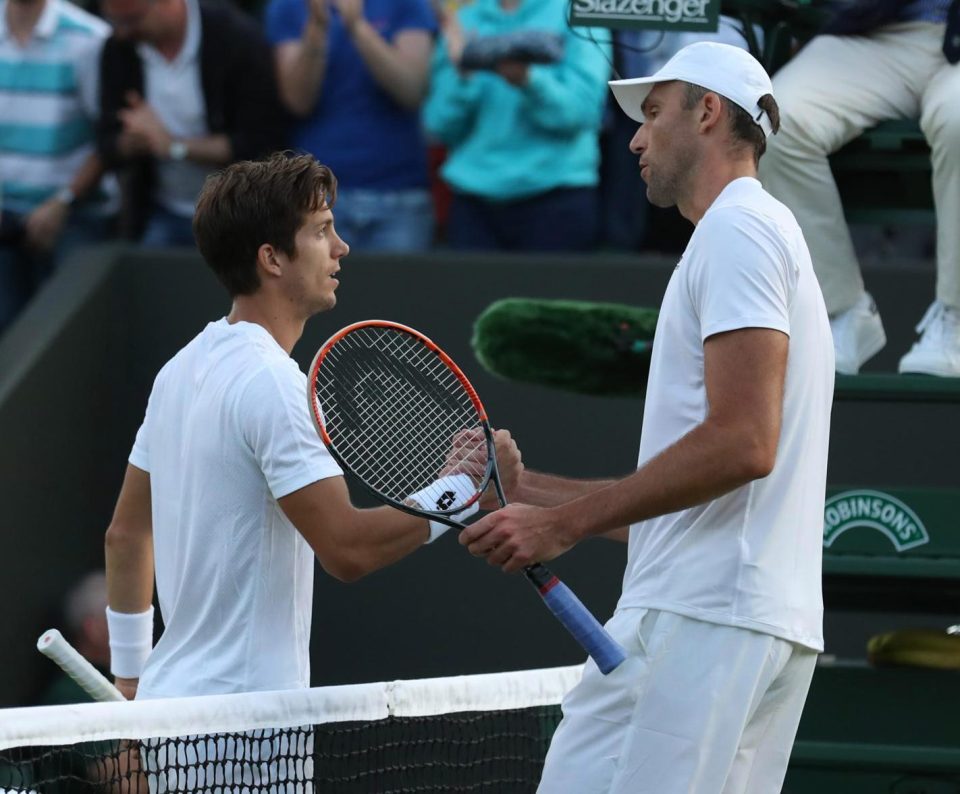  Aljaz Bedene and Ivo Karlovic shake hands after their marathon match